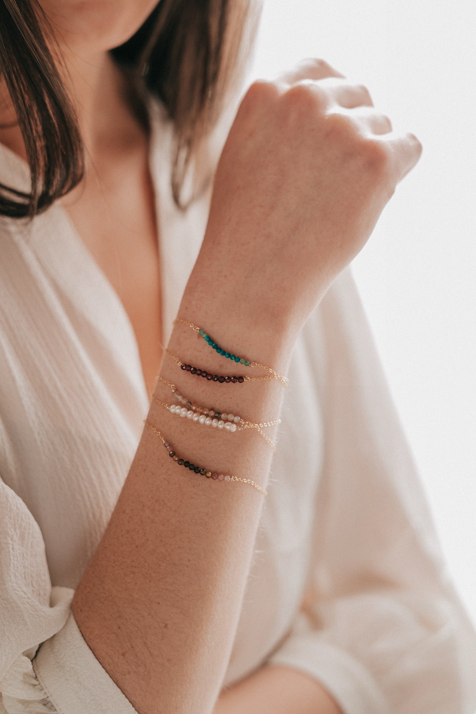 Gold bracelets on the wrist